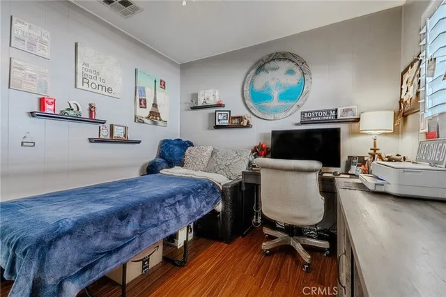 a bedroom with a bed and a fireplace