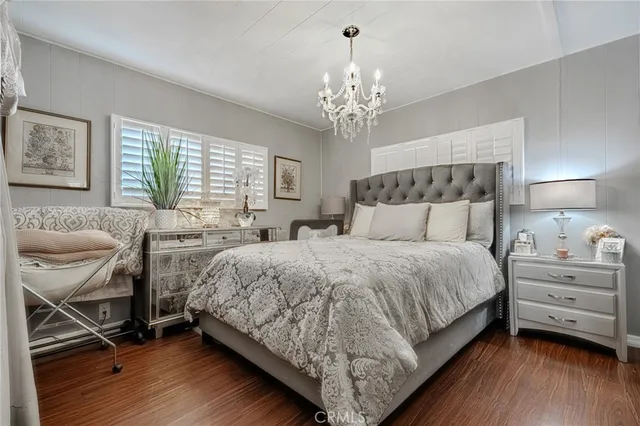 a bedroom with a bed and a chair