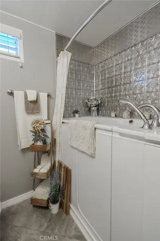 a bathroom with a sink and mirror
