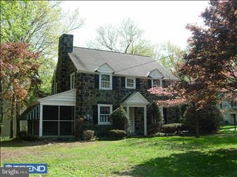 80 East Rose Tree Road Media, PA 19063 - Photo 1 of 6 a front view of a house with a yard and garage