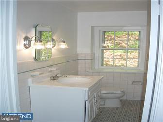 80 East Rose Tree Road Media, PA 19063 - Photo 3 of 6 a bathroom with a sink a toilet and mirror