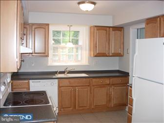 80 East Rose Tree Road Media, PA 19063 - Photo 5 of 6 a kitchen with a sink stove and cabinets