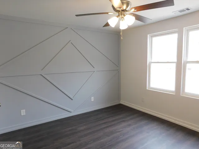 a bathroom with a toilet and a bathtub