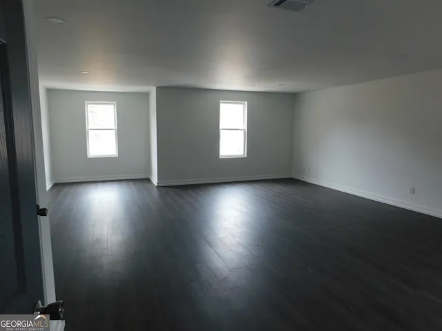 a bathroom with a sink a mirror and a bathtub