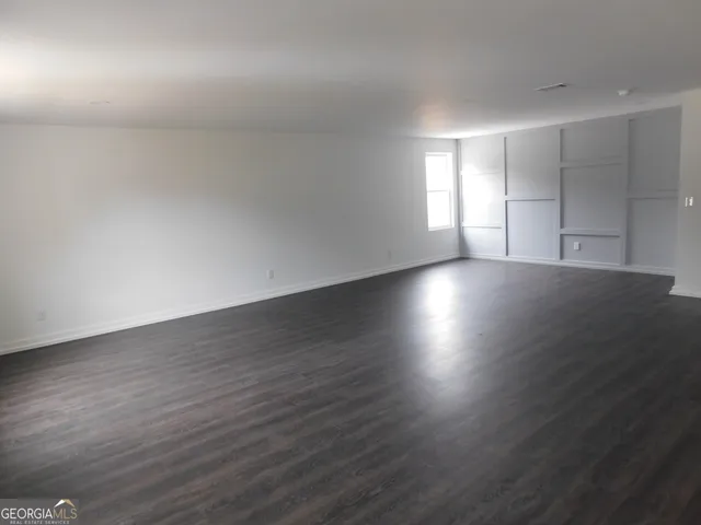 a bathroom with a sink mirror and toilet