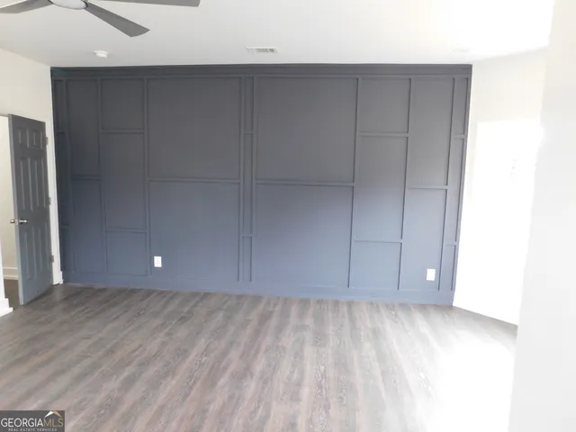 a kitchen with stainless steel appliances white cabinets and a stove