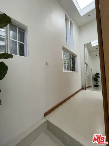 a bedroom with a bed and ceiling fan