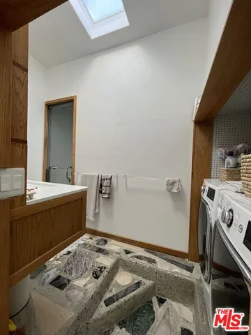 a bathroom with a sink a mirror and shower