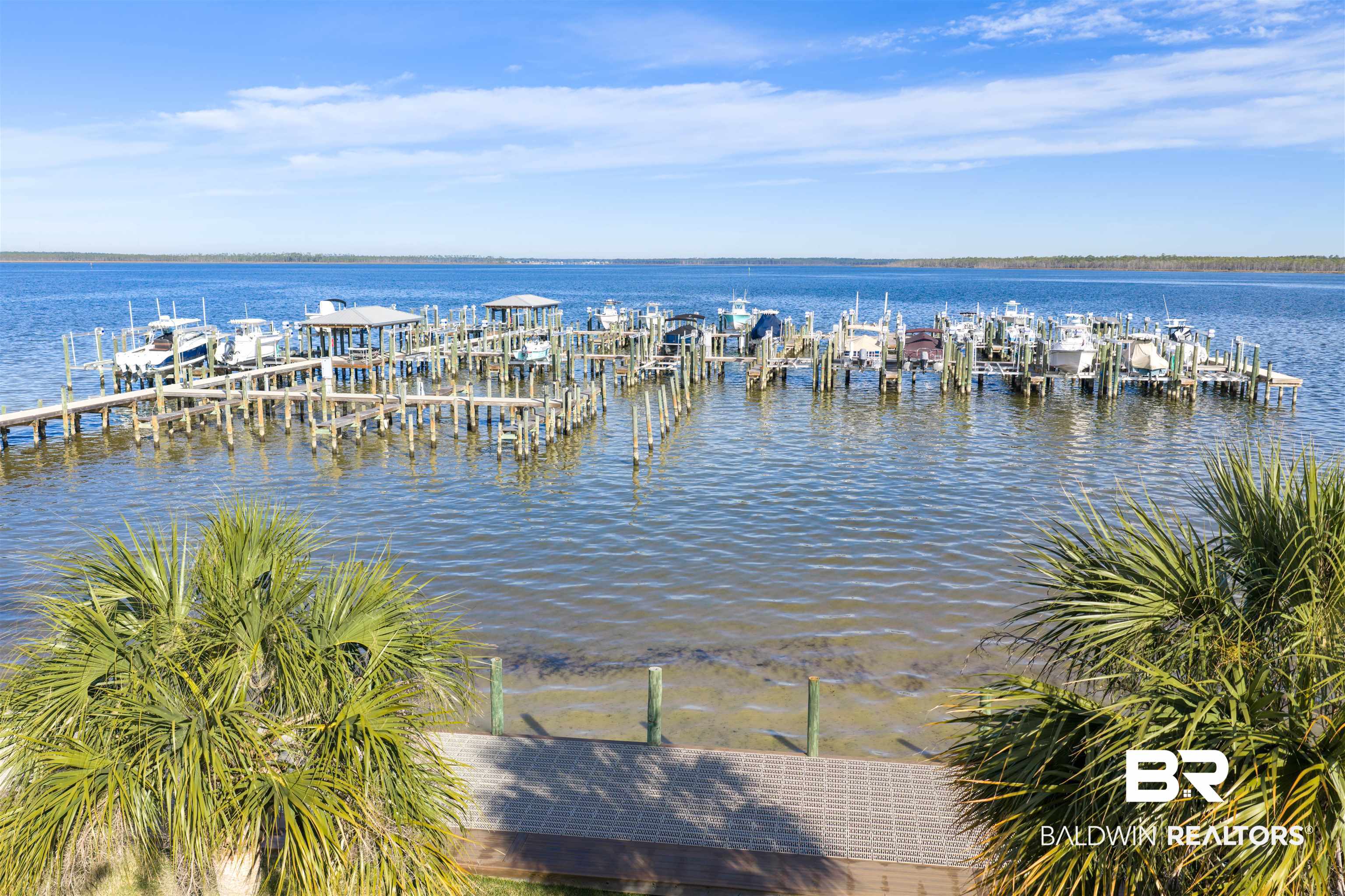 25861 Canal Road, Unit 3 Orange Beach, AL 36561 - Photo 26 of 40 Water view with boat lift and a boat dock