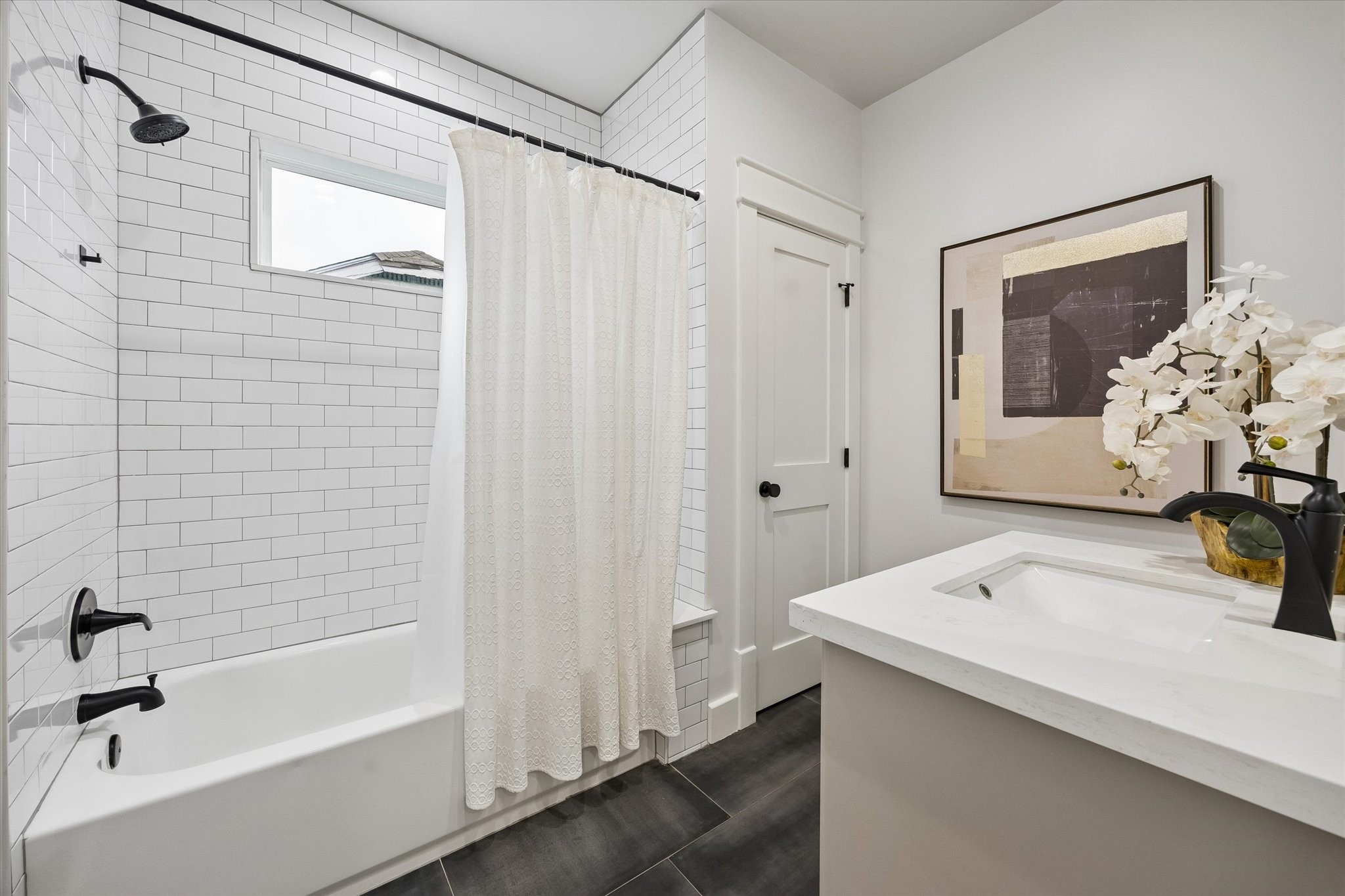 910 Northwood Street Houston, TX 77009 - Photo 15 of 28 a bathroom with a tub and a sink