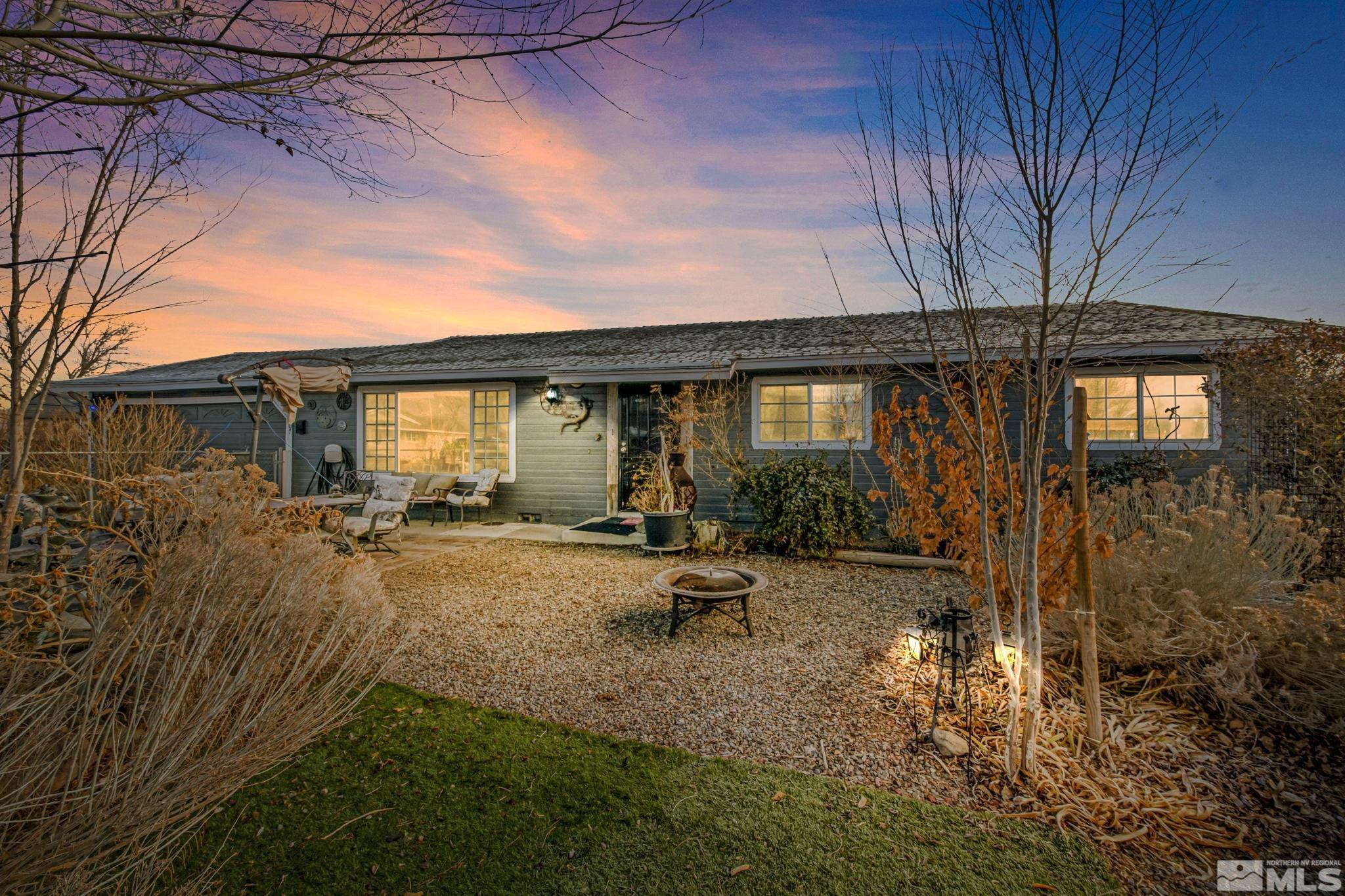 207 Ring Road Dayton, NV 89403 - Photo 1 of 40 a view of a house with backyard and sitting area