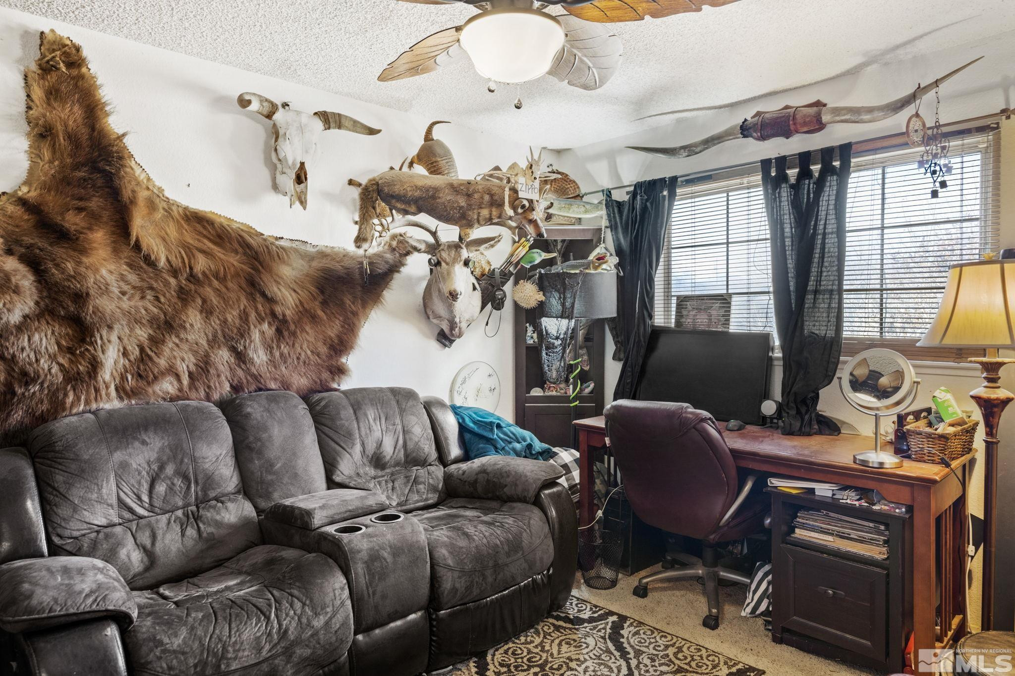 207 Ring Road Dayton, NV 89403 - Photo 23 of 40 a living room with furniture a chandelier and a fireplace