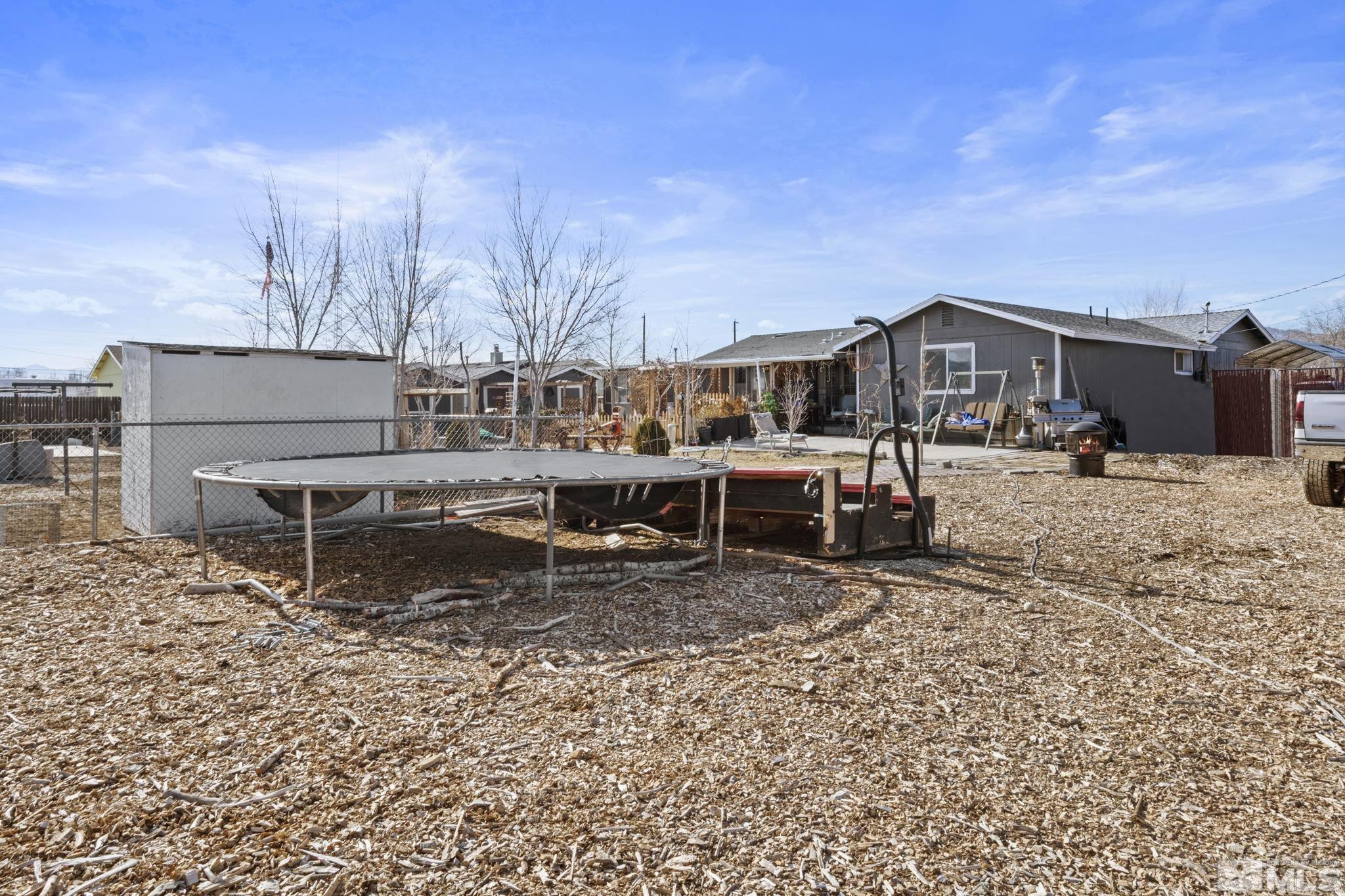 207 Ring Road Dayton, NV 89403 - Photo 32 of 40 a view of a house with a yard and sitting area