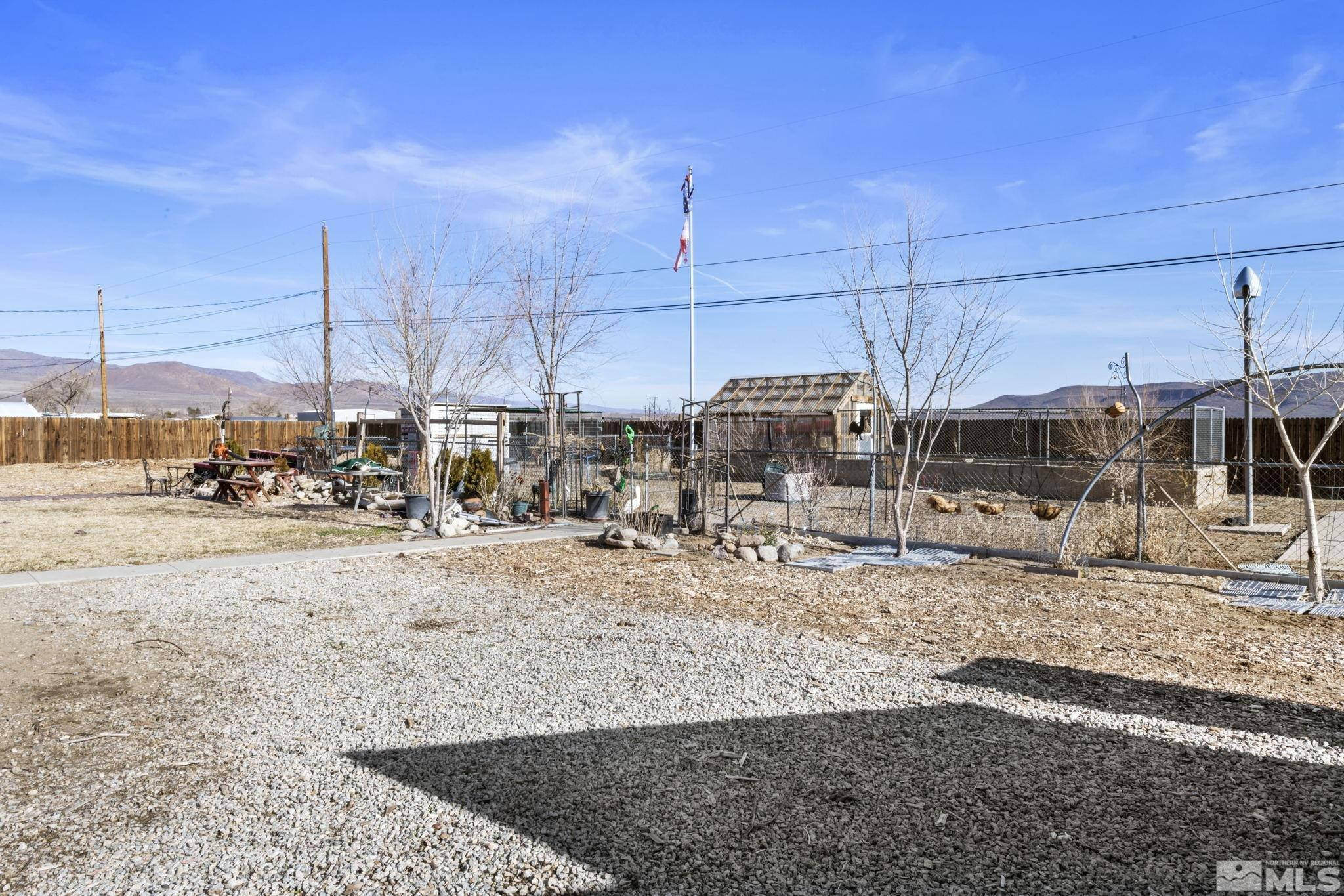 207 Ring Road Dayton, NV 89403 - Photo 33 of 40 a view of a road with wooden fence
