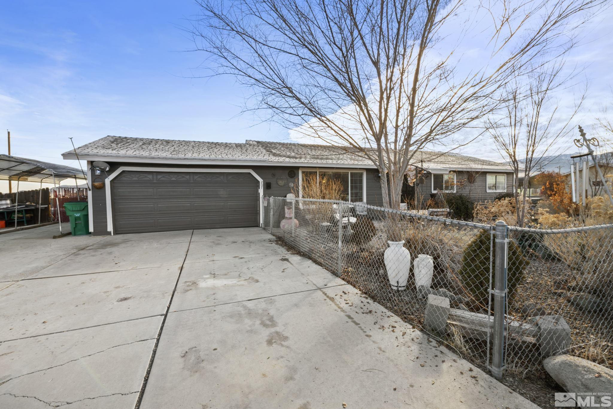 207 Ring Road Dayton, NV 89403 - Photo 36 of 40 a front view of a house with a yard