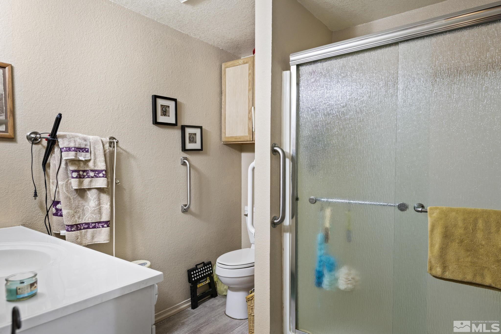 207 Ring Road Dayton, NV 89403 - Photo 10 of 40 a bathroom with a shower and a toilet