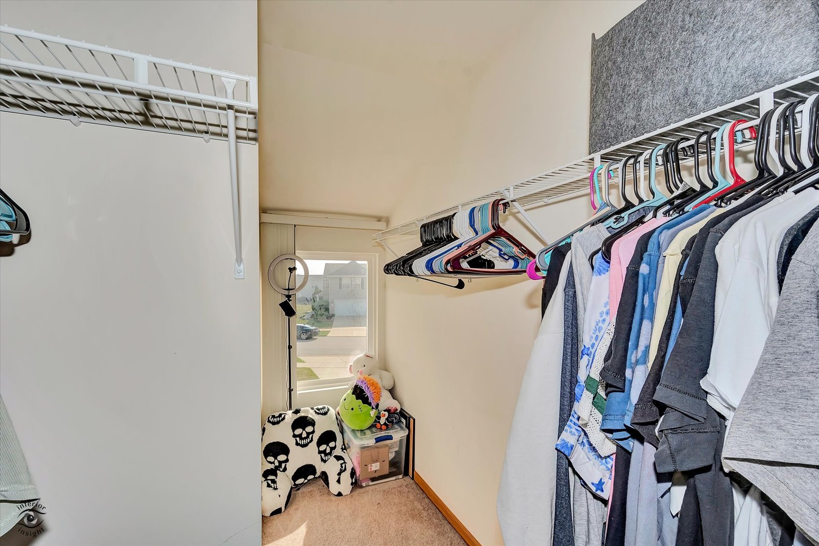 25261 Faraday Road, Unit 2 Manhattan, IL 60442 - Photo 20 of 26 a view of walk in closet with clothes and shoes