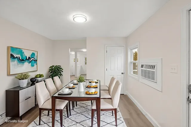 a dining room with furniture and window