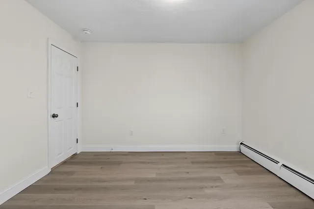 a bedroom with a bed and a flat screen television