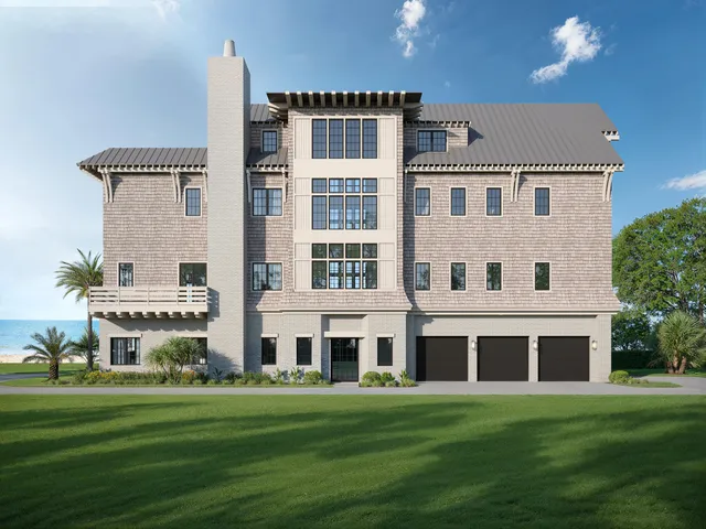 a front view of a building with a garden