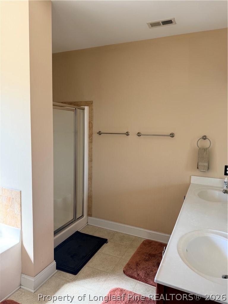 940 Pecan Grove Loop Hope Mills, NC 28348 - Photo 13 of 19 Owner's Bath