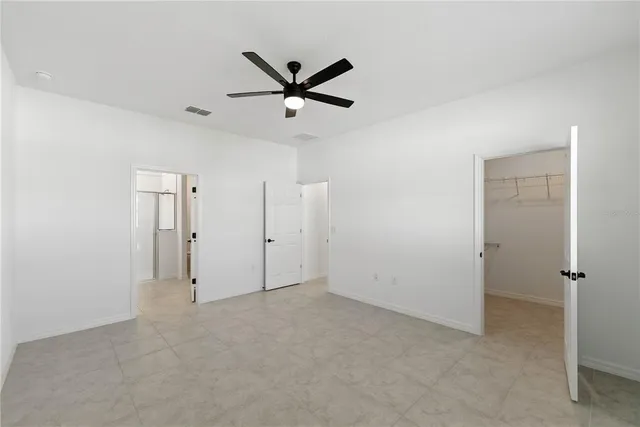 a view of a hallway with closet and front door
