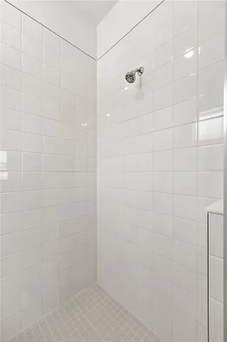 a white bath tub sitting next to a white toilet