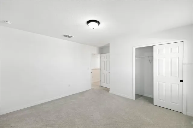 a view of a yard with cars parked