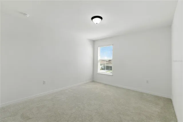 an aerial view of a house with a swimming pool