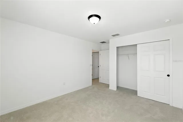 an aerial view of a house with a swimming pool