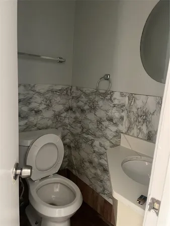 a bathroom with a toilet and a sink