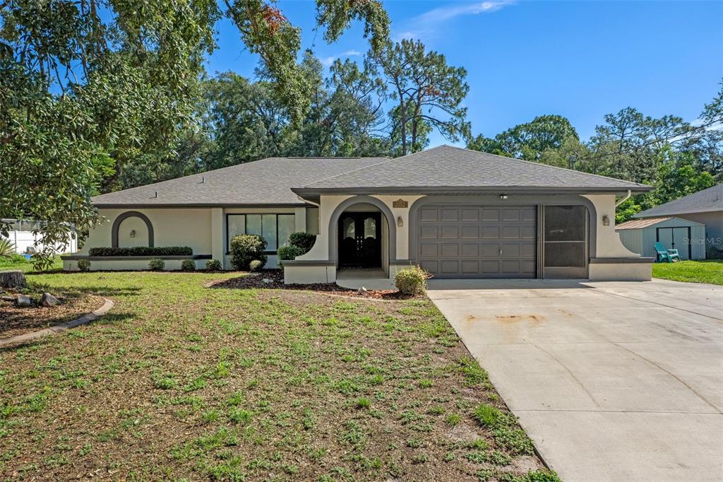 2152 Danforth Road Spring Hill, FL 34608 - Photo 1 of 1 a house view with a garden space
