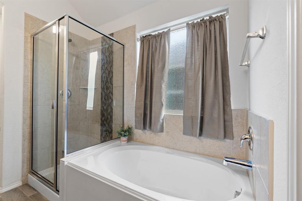 1490 Alamandine Avenue Cross Roads, TX 76227 - Photo 16 of 23 a bathroom with a shower and a bathtub