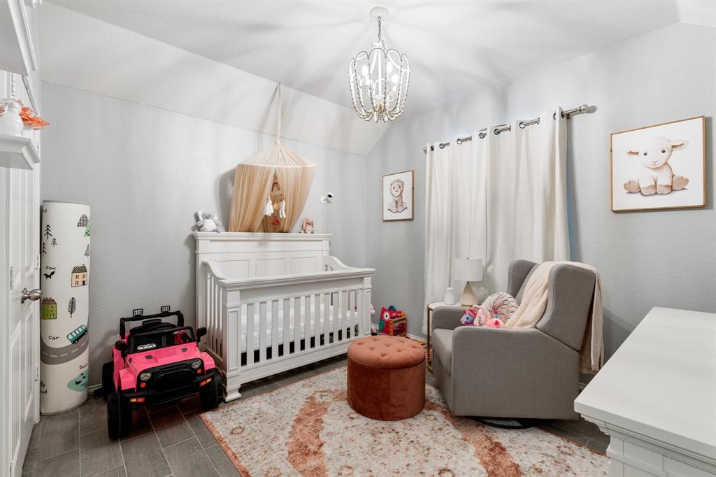 1490 Alamandine Avenue Cross Roads, TX 76227 - Photo 19 of 23 a bedroom with furniture and a window