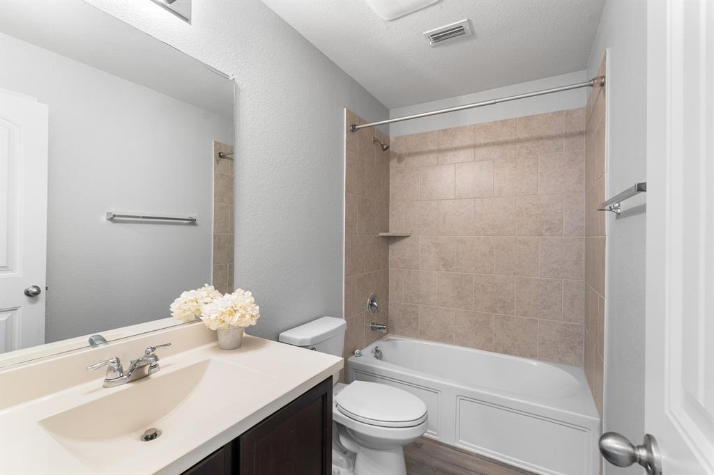 1490 Alamandine Avenue Cross Roads, TX 76227 - Photo 20 of 23 a bathroom with a sink toilet and shower