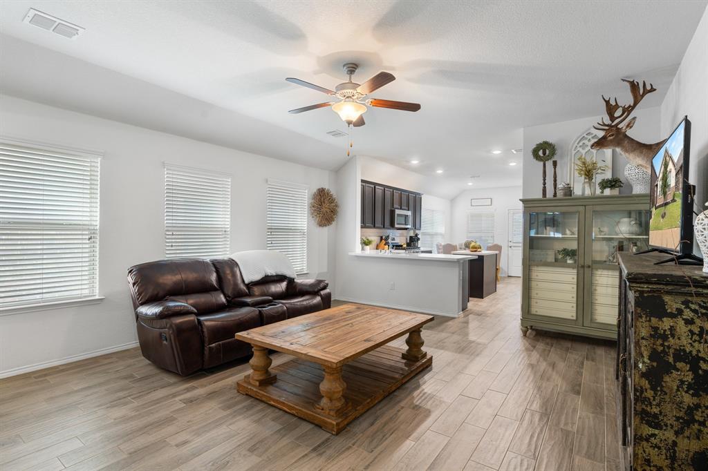 1490 Alamandine Avenue Cross Roads, TX 76227 - Photo 5 of 23 a living room with furniture and kitchen view