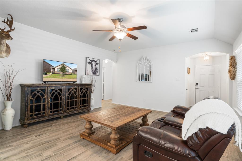 1490 Alamandine Avenue Cross Roads, TX 76227 - Photo 6 of 23 a bedroom with a bed and a chandelier