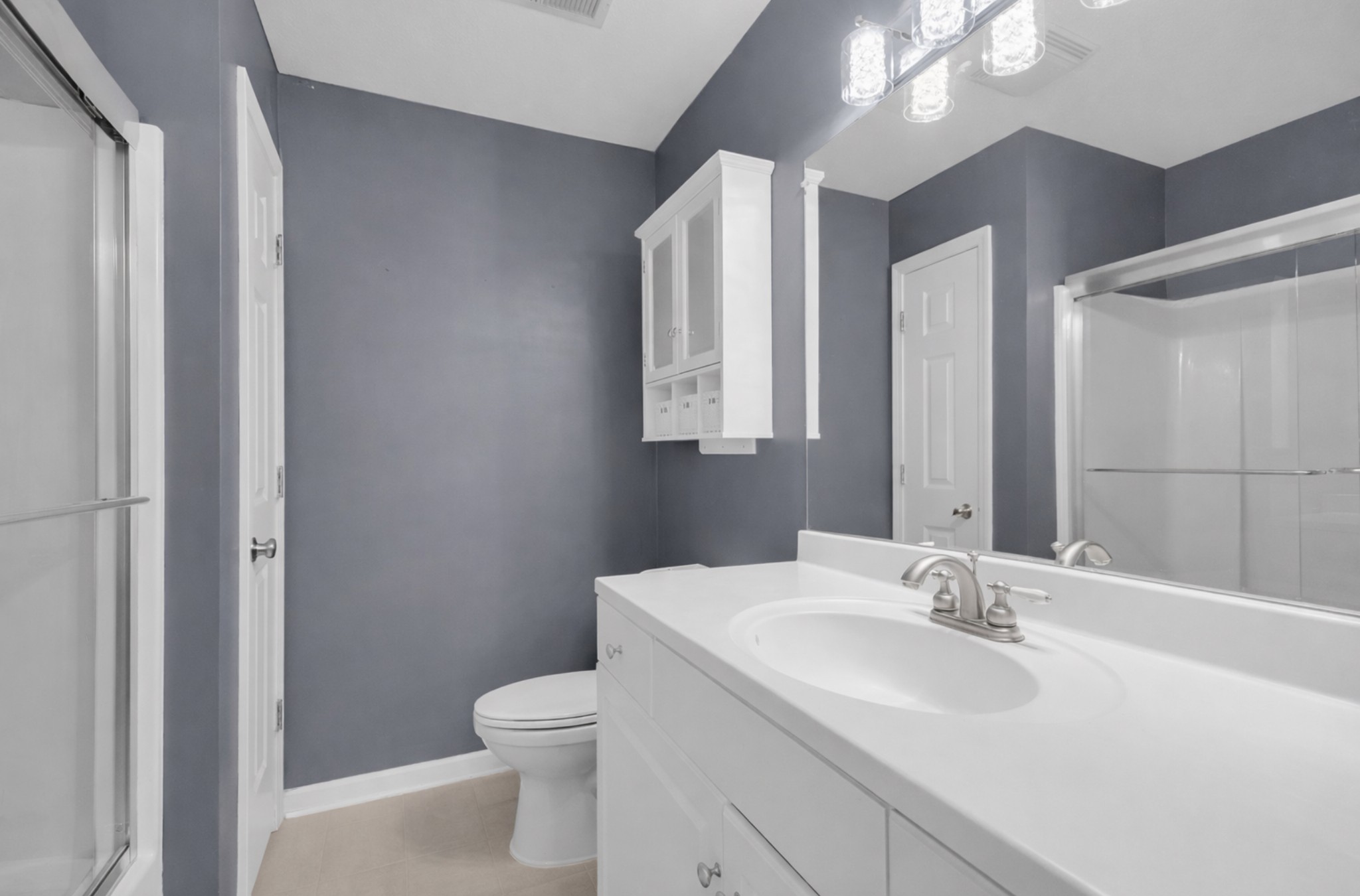 1095 Taylor Lane Newbern, TN 38059 - Photo 11 of 18 a bathroom with a toilet sink and mirror