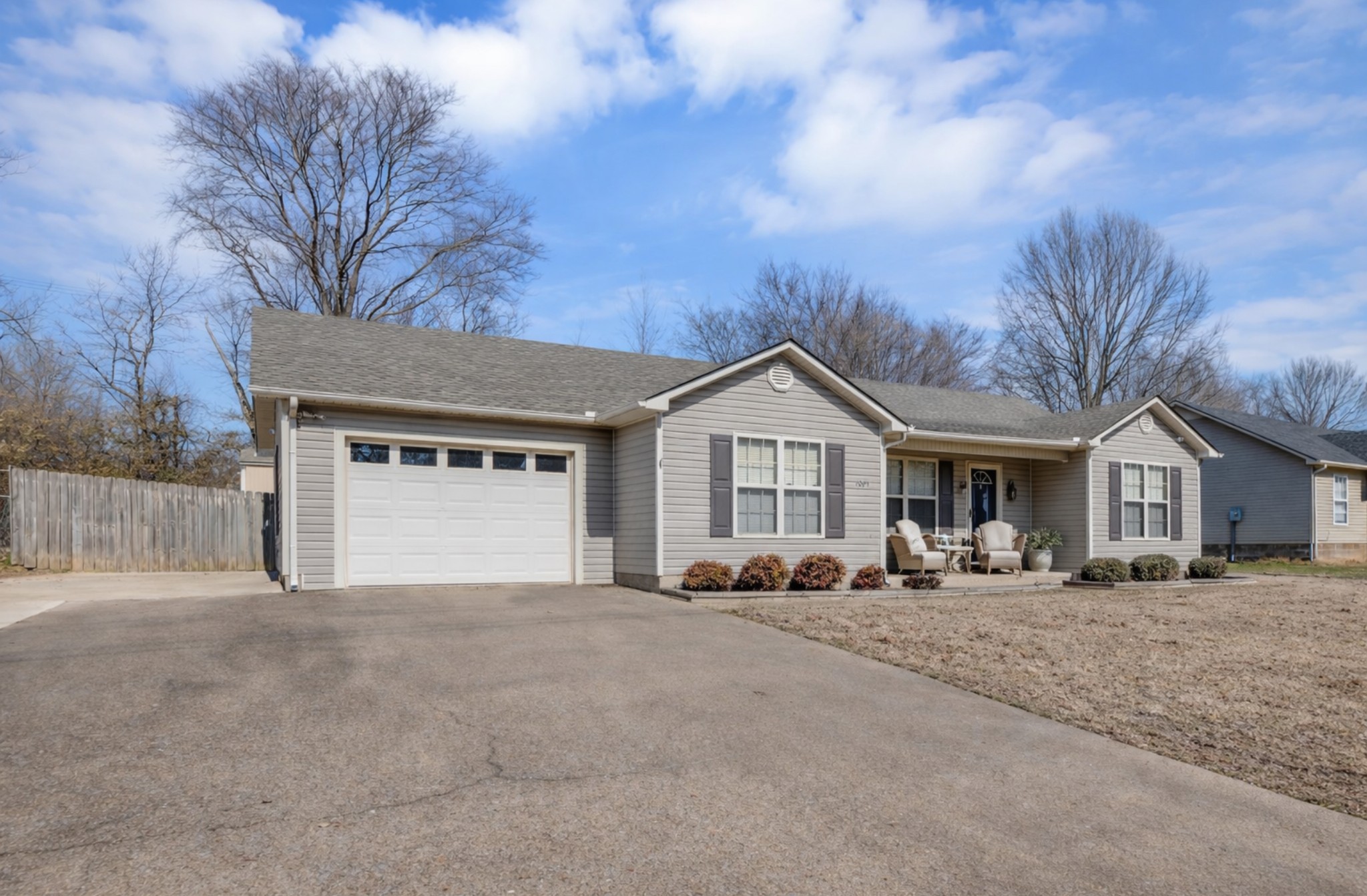 1095 Taylor Lane Newbern, TN 38059 - Photo 3 of 18 a front view of a house with a yard and garage
