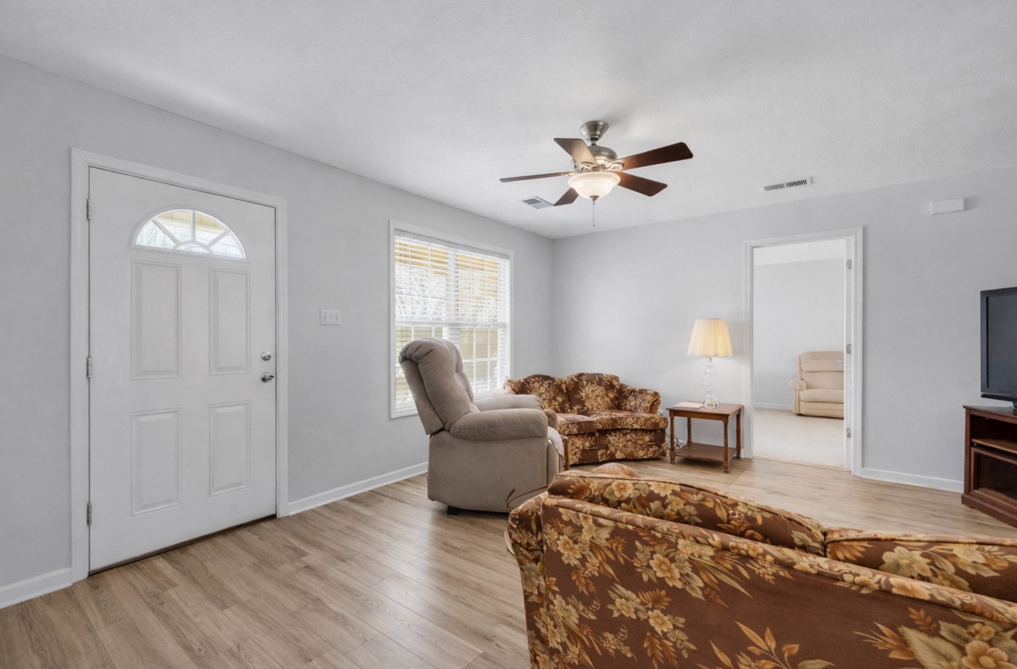 1095 Taylor Lane Newbern, TN 38059 - Photo 6 of 18 a living room with furniture a two couches and a chandelier