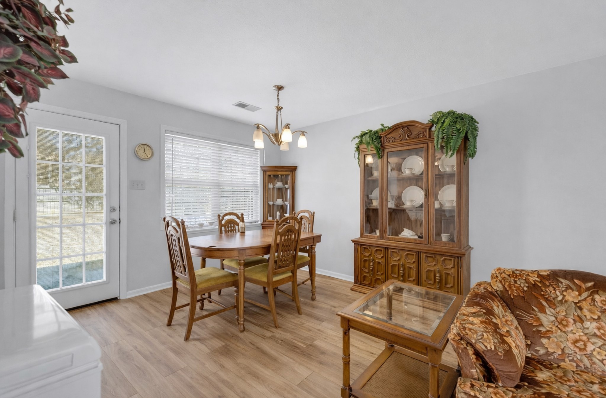 1095 Taylor Lane Newbern, TN 38059 - Photo 7 of 18 a view of a dining room with furniture and chandelier