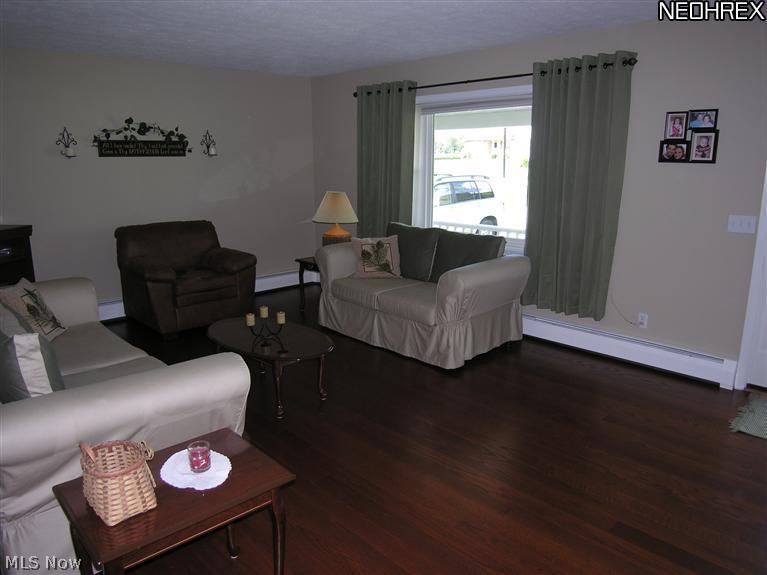 10267 Murray Ridge Road Elyria, OH 44035 - Photo 3 of 25 Living room with wood floors. Newer windows.
