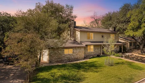 a swimming pool with outdoor seating and yard