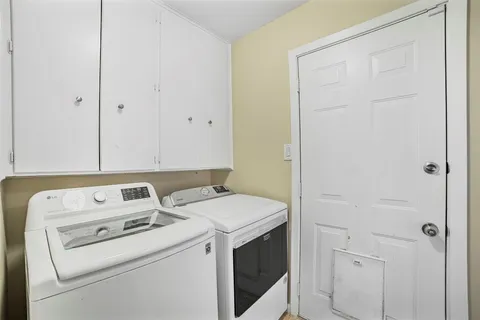 a view of storage and utility room with washer and dryer