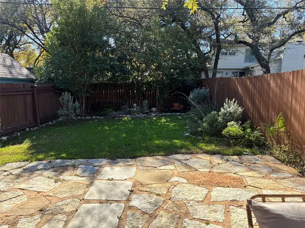 a backyard of a house with lots of green space