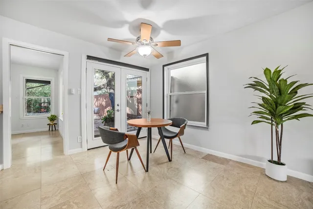 a view of a livingroom with furniture and a potted plant