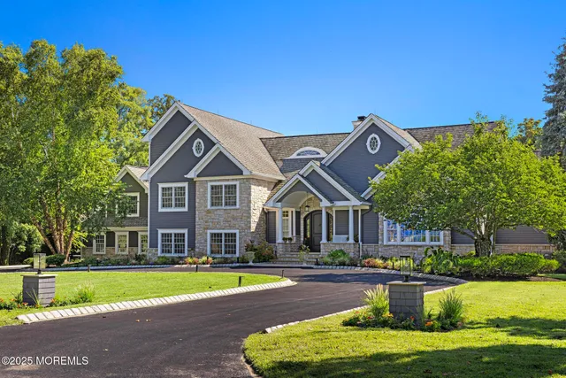 a view of a livingroom with wooden floor and furniture