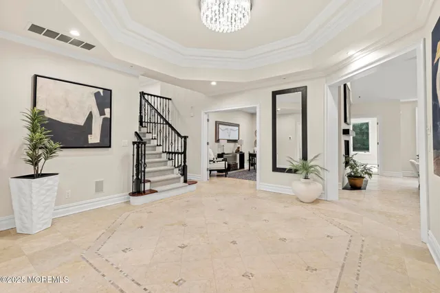 a living room with furniture a rug and a window