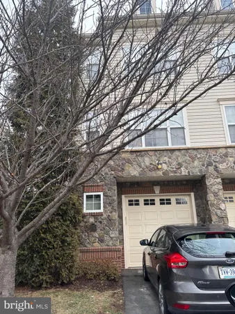 a front view of a house with parking space
