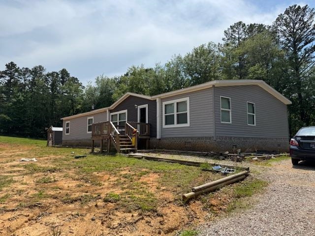 4216 Sandy Flat Road Bethel Springs, TN 38315 - Photo 13 of 15 a front view of a house with a yard